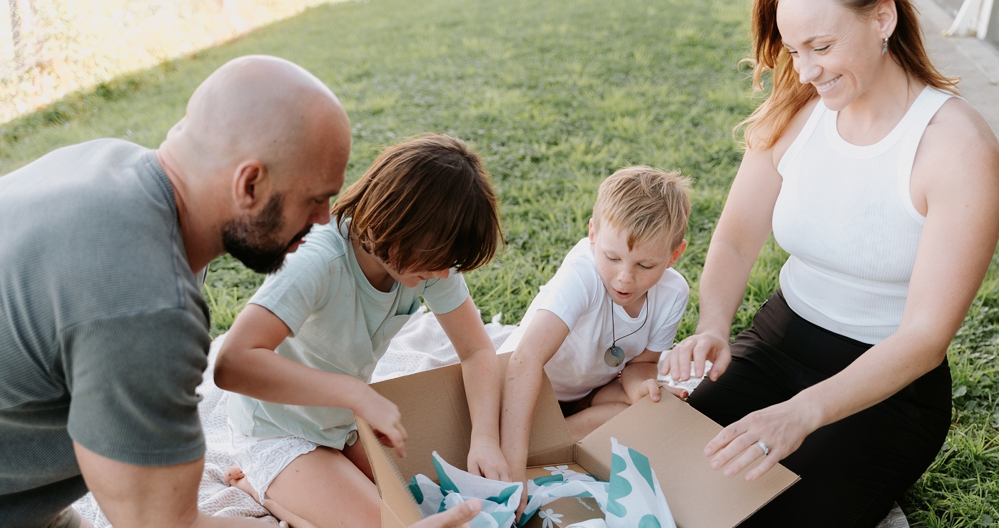 two kids and two adults playing with therapy at home kits