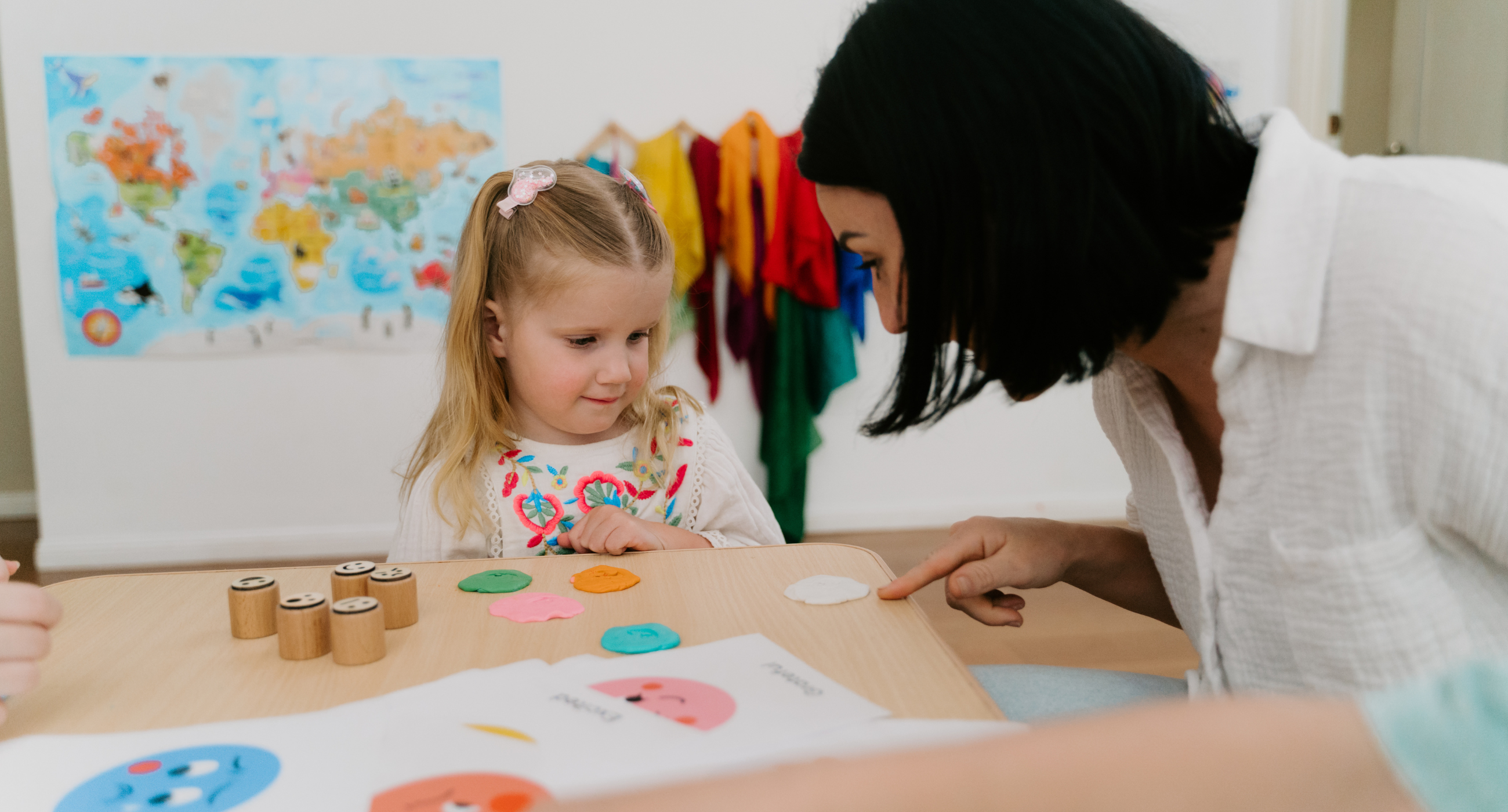 Aldult and child painting together