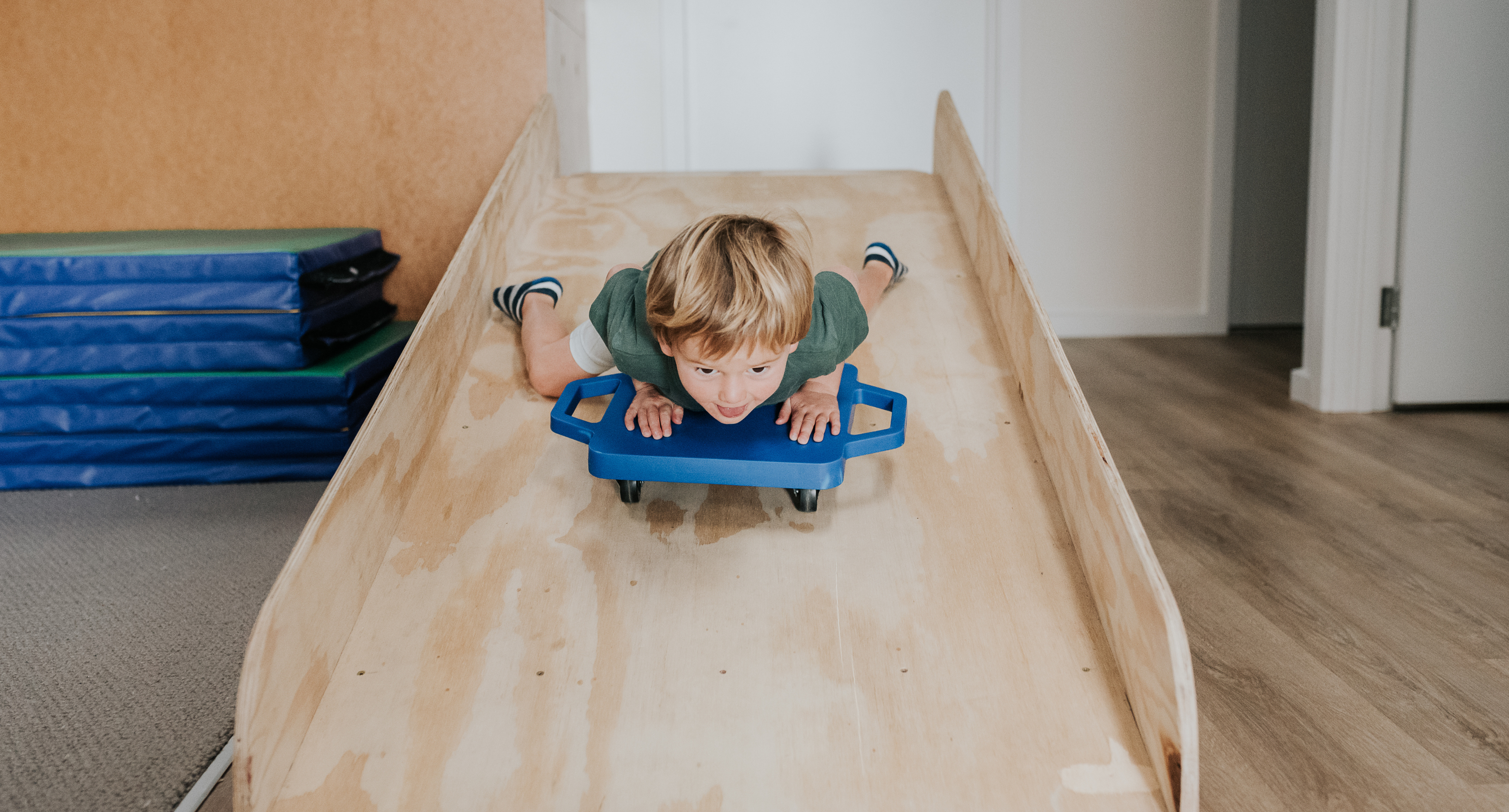 kid sliding down a slide